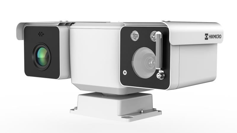 Hikvision thermal camera HM-TD5567T-25/W mounted outdoors, showcasing its black weather-resistant housing and lens for thermal imaging.